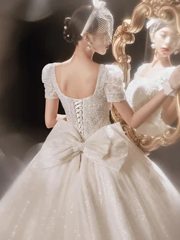 Pagrindinis Vestuvių Suknelė 2022 Nauja Nuotaka Vakarų Stiliaus Uodegos Šviesos Siūlai, Nėriniai Kilnus, Elegantiškas, Paprastas Atmosferos Suknelė Tiekimo Vestuvių Suknelė